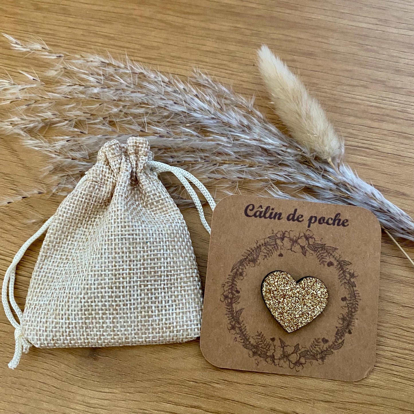 câlin de poche coeur en bois pailleté avec son pochon