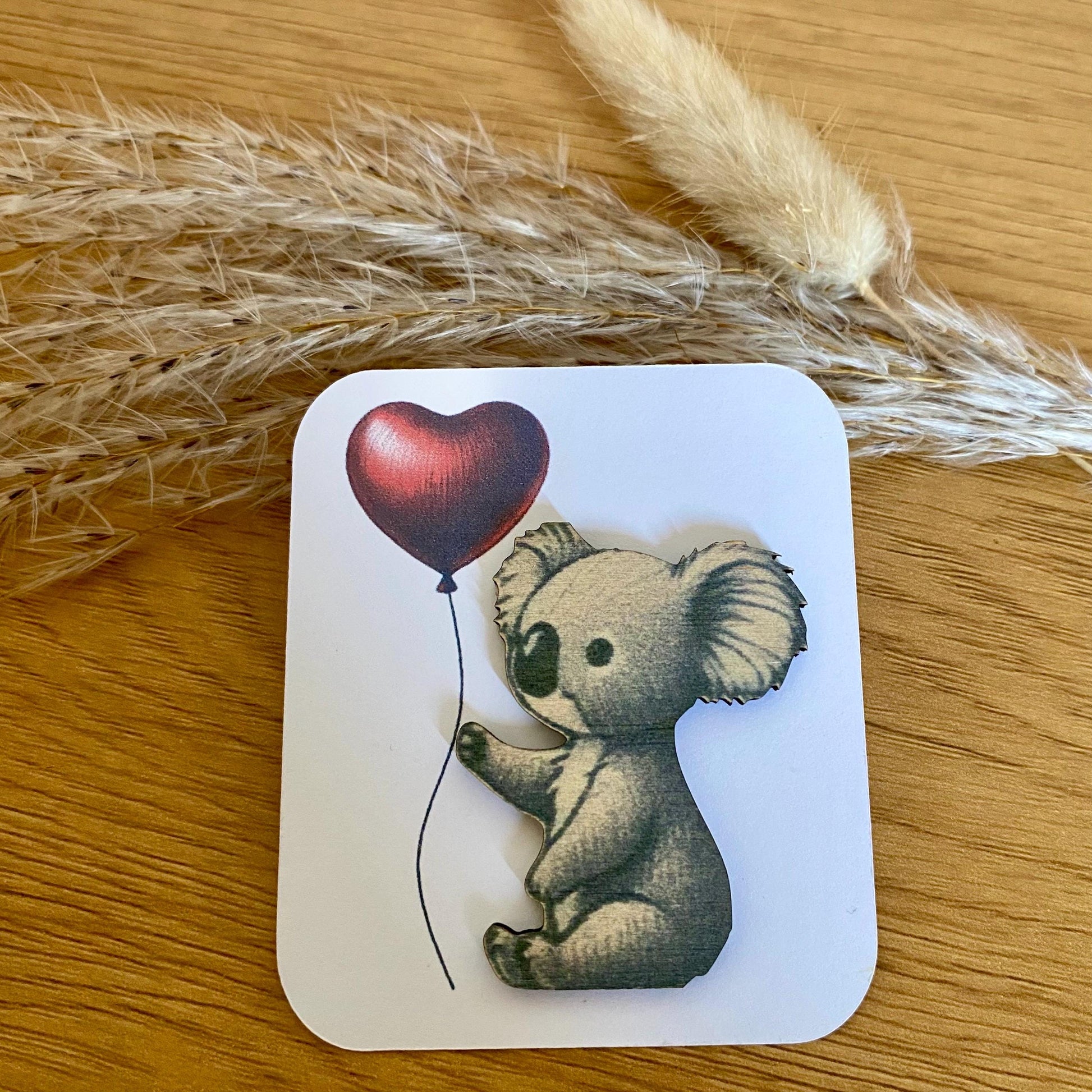 Câlin de poche en bois forme koala avec sa carte